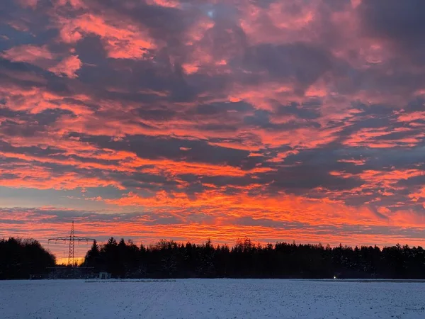 Scenic sunrise above a winter landscape in the Munich suburbs