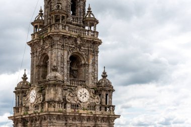 Rich decorated classicistic bell tower of the famous cathedral in Santiago de Compostela, Galicia region in Spain clipart