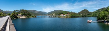 Panoramic view of lake Cavado at the Peneda Geres National Park near Rio Caldo village, in Portugal clipart