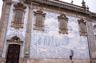 Picturesque historic Azulejo tiles at the exterior of chapel Almas de Santa Catarina in Porto, Portugal clipart