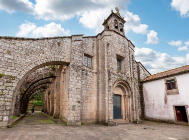 Ancient collegiate church Santa Maria de Sar in Santiago de Compostela with giant buttresses, subsequently built due to static problems, Spain clipart