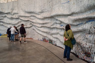 Bilbao, Spain - Mai 16, 2024 - Contemporary art installation Rising Sea in the Guggenheim Musem Bilbao, Basque, designed by El Anatsui clipart