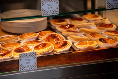 Porto, Portugal - Mai 24, 2024 - Famous Pastei de Nata at the Bolhao market hall in Porto, Portugal clipart