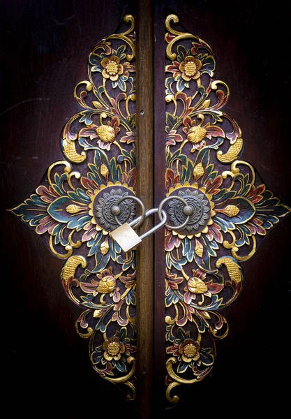 Balinese intricate wood carved doors with brass lock and knobs