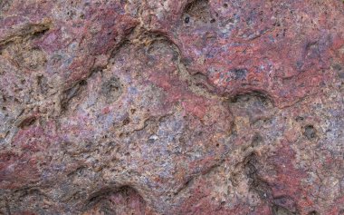 Multi color boulder with cracks and bumps background texture