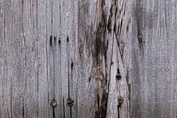 老旧生锈的钉子头背景和墙纸质地的干枯 褪色的木板 — 图库照片