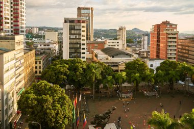PEREIRA, COLOMBIA-JANUARY 25, 2023: Plaza de Bolivar framed by the beautiful architecture of the city, its leafy mango trees and beautiful tropical palm trees. Pereira the capital of the axis.