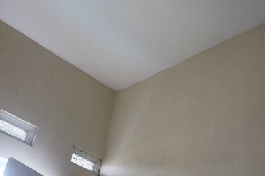 a photo of a corner of the wall of a room with white paint