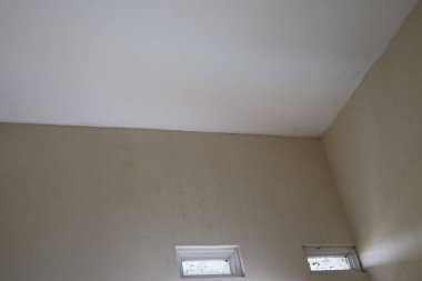 a photo of a corner of the wall of a room with white paint