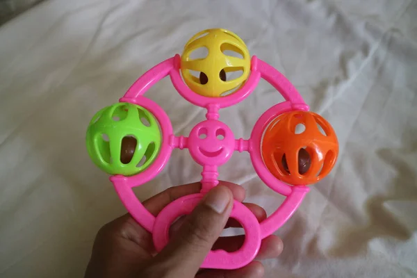 Photo Colorful Toddler Toy Can Make Tinkling Sound Pink Handle — 스톡 사진