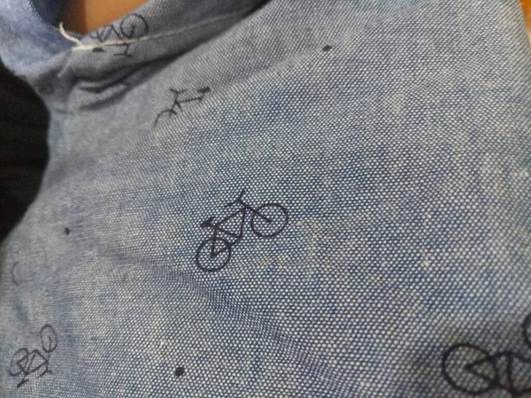 Une Photo Une Texture Tissu Gris Avec Une Image Vélo — Photo