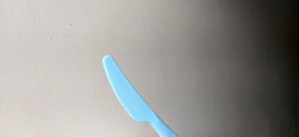 Photo Knife Cutting Steak Blue Made Plastic — Stock Photo, Image