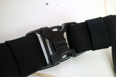 a photo of a large black strap lock bag