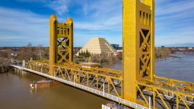 The Tower Bridge in Sacramento, California with the city of of Sacramento in the background and blue sky