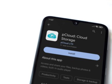 Lod, Israel - July 16,2023: pCloud app play store page on smartphone on white background. Top view flat lay with copy space.