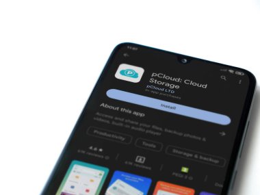 Lod, Israel - July 16,2023: pCloud app play store page on smartphone on white background. Top view flat lay with copy space.