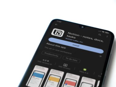 Lod, Israel - July 16,2023: Notion app play store page on smartphone on white background. Top view flat lay with copy space.