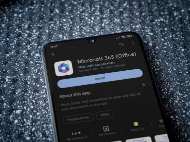 Lod, Israel - July 16,2023: Microsoft 360 app play store page on smartphone on a metallic background. Close up top view flat lay.