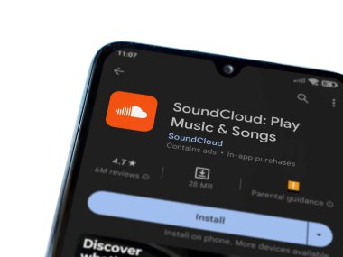 Lod, Israel - July 16,2023: SoundCloud app play store page on smartphone on white background. Top view flat lay with copy space.
