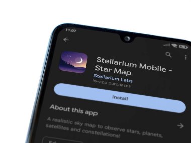 Lod, Israel - July 16,2023: Stellarium - Star Map app play store page on smartphone on white background. Top view flat lay with copy space.