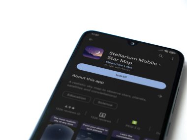 Lod, Israel - July 16,2023: Stellarium - Star Map app play store page on smartphone on white background. Top view flat lay with copy space.