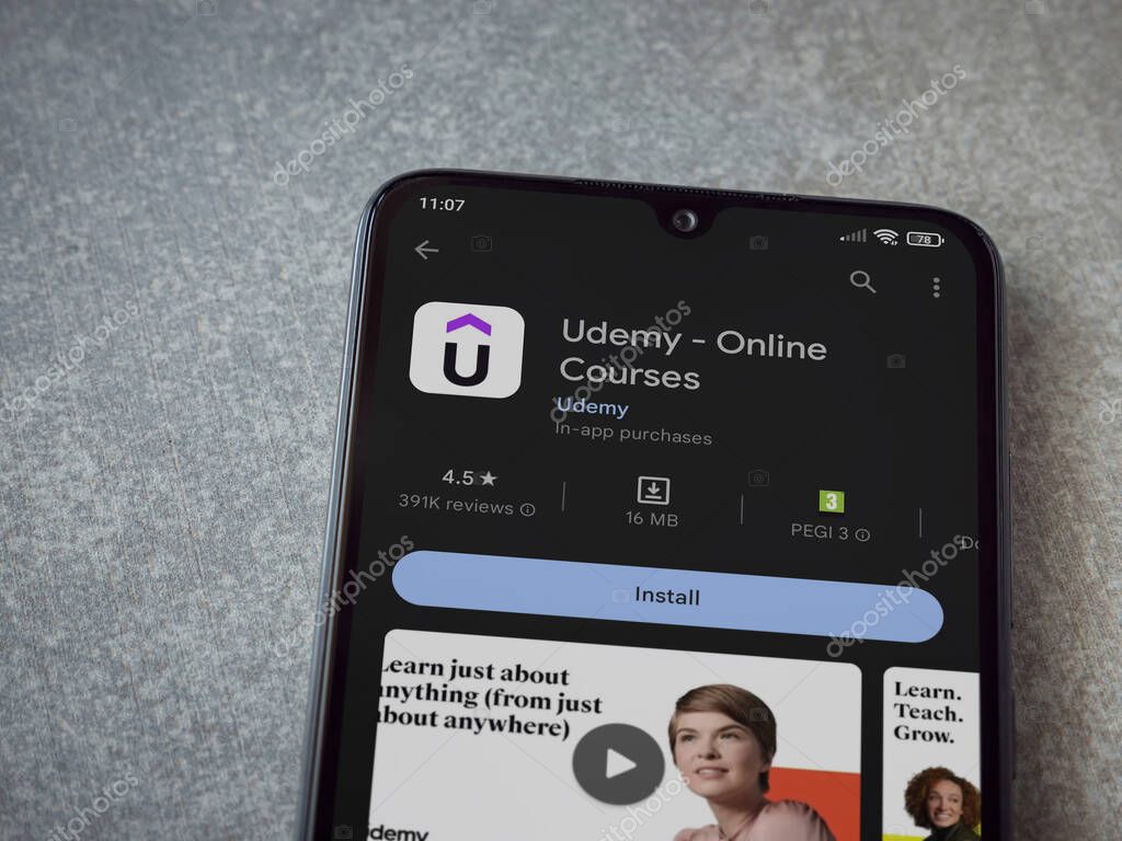 Lod, Israel - July 16,2023: Udemy app play store page on smartphone on ceramic stone background. Top view flat lay with copy space.