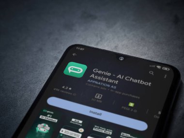 Lod, Israel - July 16,2023: Genie app play store page on smartphone on a dark marble stone background. Top view flat lay with copy space.
