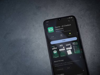 Lod, Israel - July 16,2023: Genie app play store page on smartphone on a dark marble stone background. Top view flat lay with copy space.