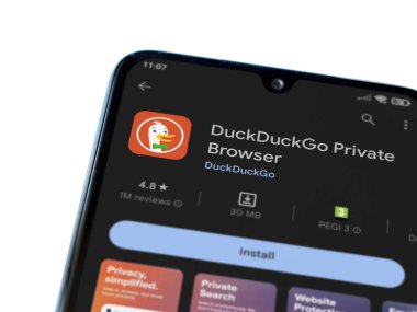 Lod, Israel - July 16,2023: DuckDuckGo Private Browser app play store page on smartphone on white background. Top view flat lay with copy space.
