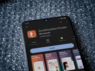 Lod, Israel - July 16,2023: DuckDuckGo Private Browser app play store page on smartphone on a metallic background. Close up top view flat lay.