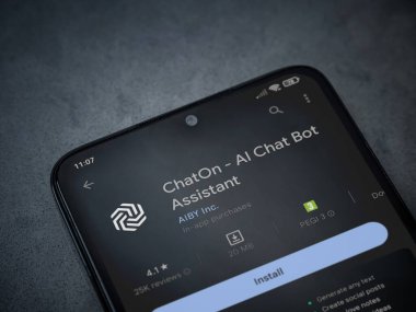 Lod, Israel - July 16,2023: ChatOn app play store page on smartphone on a dark marble stone background. Top view flat lay with copy space.