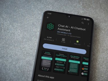Lod, Israel - July 16,2023: Chat AI app play store page on smartphone on ceramic stone background. Top view flat lay with copy space.