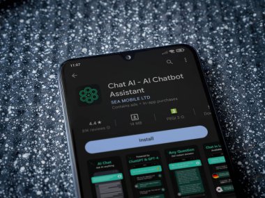 Lod, Israel - July 16,2023: Chat AI app play store page on smartphone on a metallic background. Close up top view flat lay.