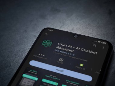 Lod, Israel - July 16,2023: Chat AI app play store page on smartphone on a dark marble stone background. Top view flat lay with copy space.