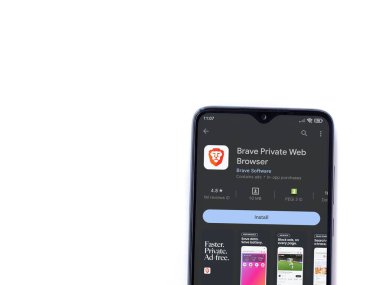 Lod, Israel - July 16,2023: Brave Private Browser app play store page on smartphone on white background. Top view flat lay with copy space.
