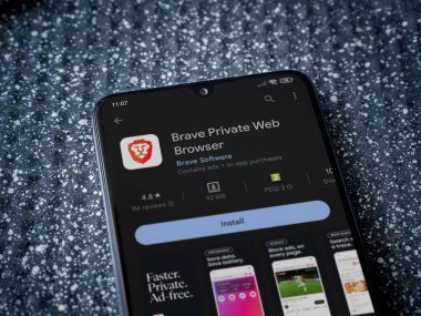 Lod, Israel - July 16,2023: Brave Private Browser app play store page on smartphone on a metallic background. Close up top view flat lay.