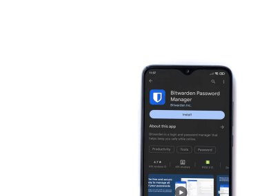 Lod, Israel - July 16,2023: Bitwarden Password Manager app play store page on smartphone on white background. Top view flat lay with copy space.