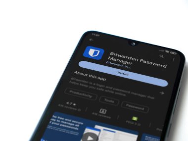 Lod, Israel - July 16,2023: Bitwarden Password Manager app play store page on smartphone on white background. Top view flat lay with copy space.