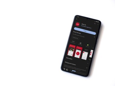 Lod, Israel - July 16,2023: Avis IL app play store page on smartphone on white background. Top view flat lay with copy space.
