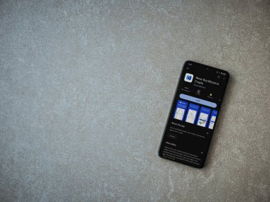 Lod, Israel - 16 Temmuz 2023: Seramik taş zemin üzerinde akıllı telefondan Nexo uygulaması oyun mağazası sayfası. Üst görünüm düzlüğü kopyalama alanı ile yatıyordu.