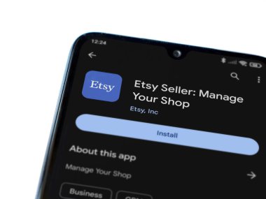 Lod, Israel - 16 Temmuz 2023: Etsy Seller uygulama oyun mağazası sayfası beyaz arka planda akıllı telefon. Üst görünüm düzlüğü kopyalama alanı ile yatıyordu.