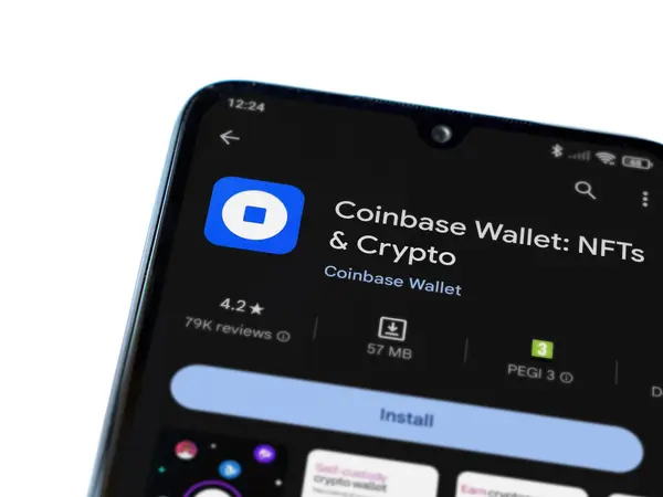 stock image Lod, Israel - July 16,2023: Coinbase Wallet app play store page on smartphone on white background. Top view flat lay with copy space.