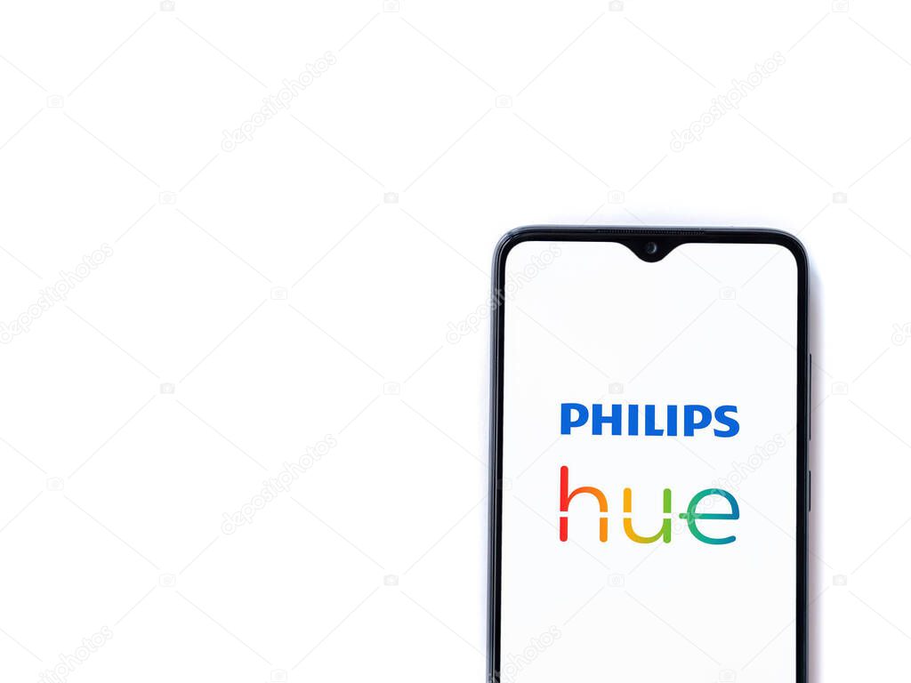Lod, Israel - July 16,2023: Philips Hue app launch screen on smartphone on white background. Top view flat lay with copy space.