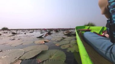 Take a scenic boat ride at Thung Bua Daeng, Bueng Lahan, Chaiyaphum, Thailand.