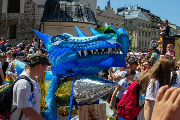 stock image Cracow, Malopolska, Poland - 04.06.2023: The animated dragon marching during the Dragons Parade, the annual event in the center of Old Town. High quality photo
