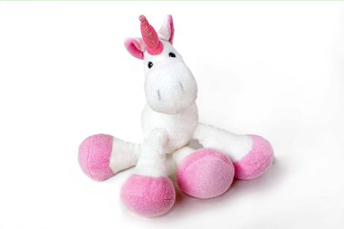 Lovely white pony doll isolated on white background. Adorable teddy bear for decorative. High quality photo