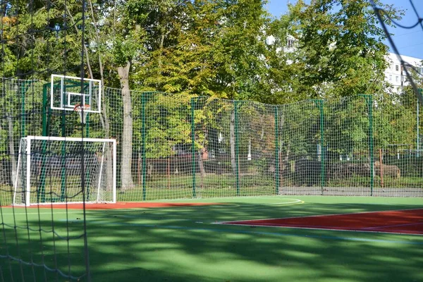 stock image School soccer stadium. Empty soccer field behind the iron fence. High quality photo