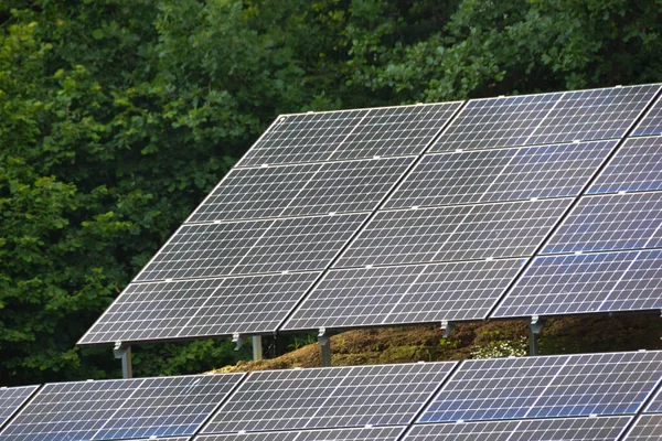 stock image House roof with photovoltaic modules. Historic farm house with modern solar panels on roof and wall High quality photo