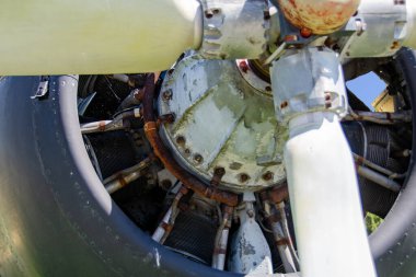 detail of old airplane engine with propeller. Close up of a red plane propeller. Damaged jet engine on large aircraft. World War II era heavy bomber engine and propeller closeup. High quality photo clipart