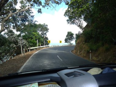 Driving on a road in New Zealand.           